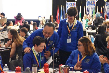 Middle College High earns second straight title at National Academic Decathlon Coach Allen Tong presents Highest Scoring Team Member Award to Randen Banuelos. Coach Janet Bengtson and Jasmine Oliveira look on.